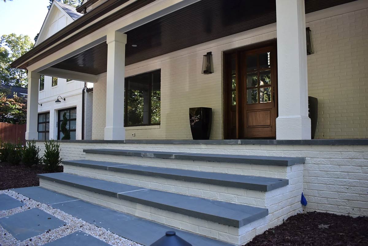 Photo of new (expanded) front porch with bluestone pavers