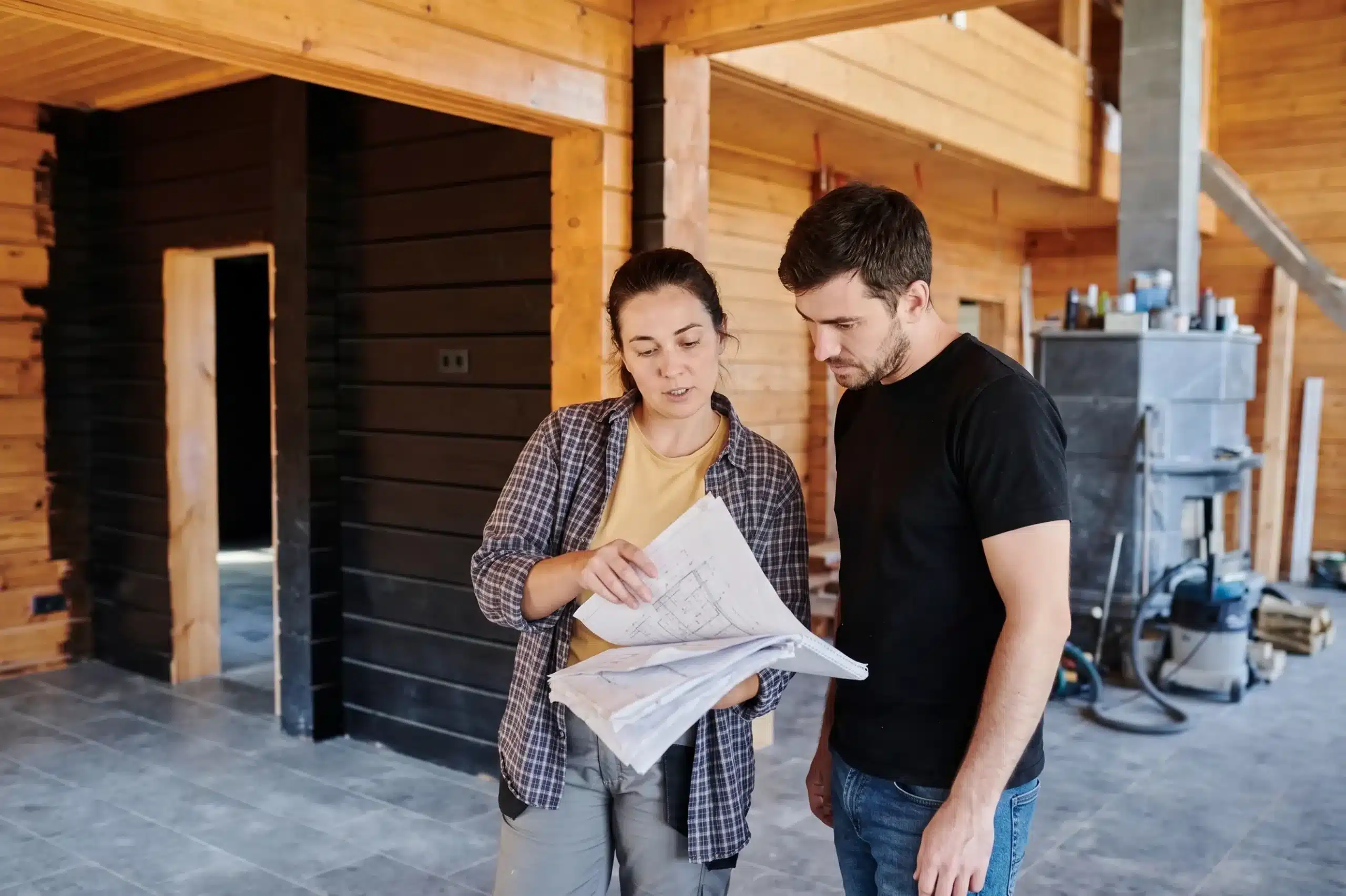 project manager look over plans for a house